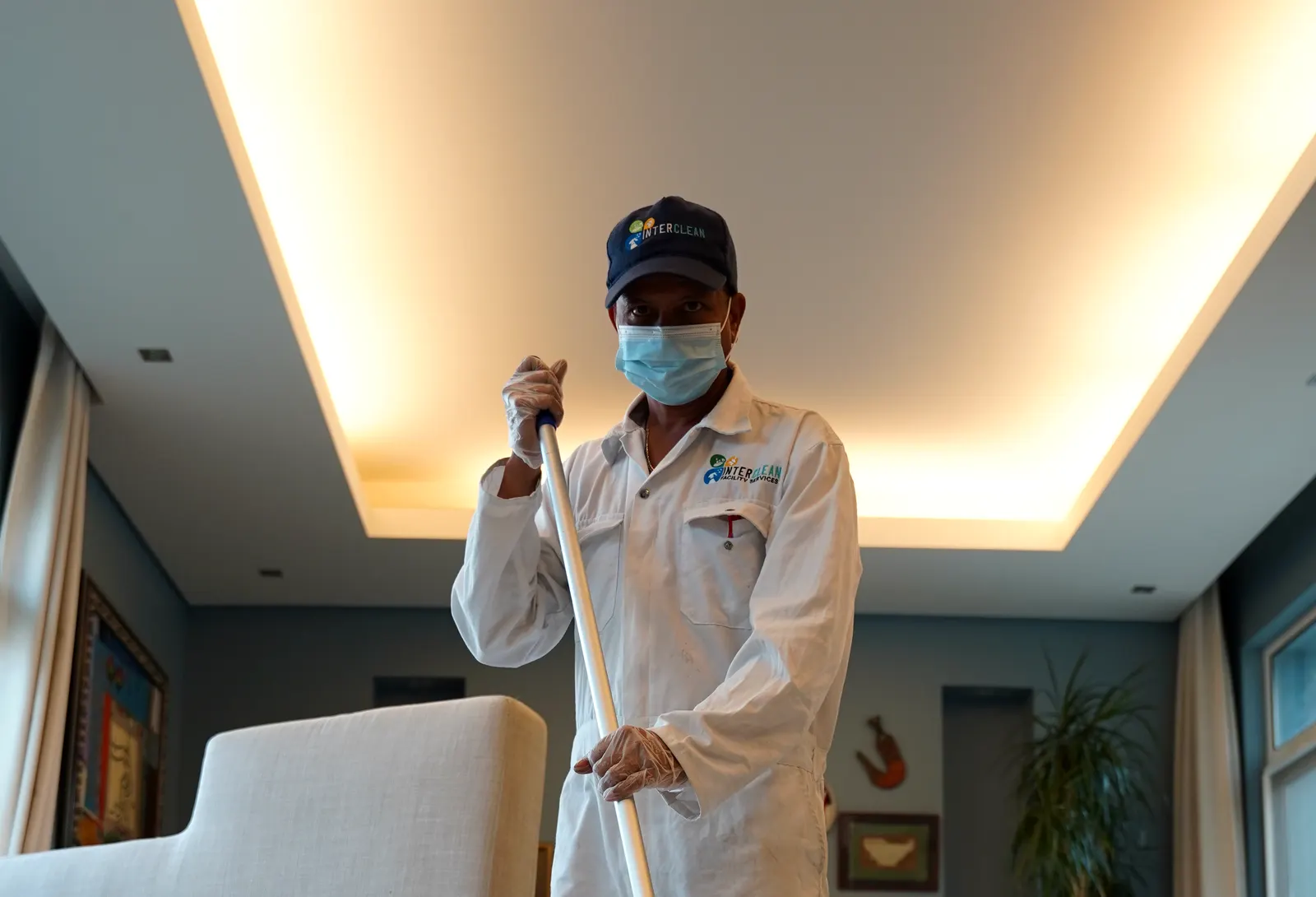 Interclean technician deep cleaning a living room