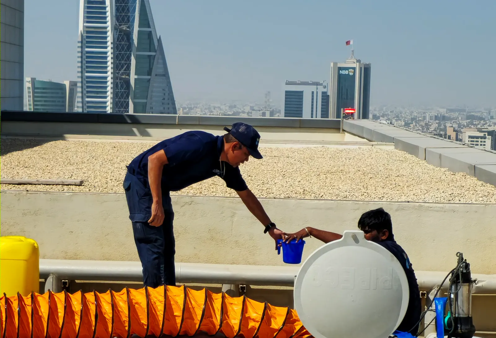 Water tank cleaning on a Bahrain rooftop